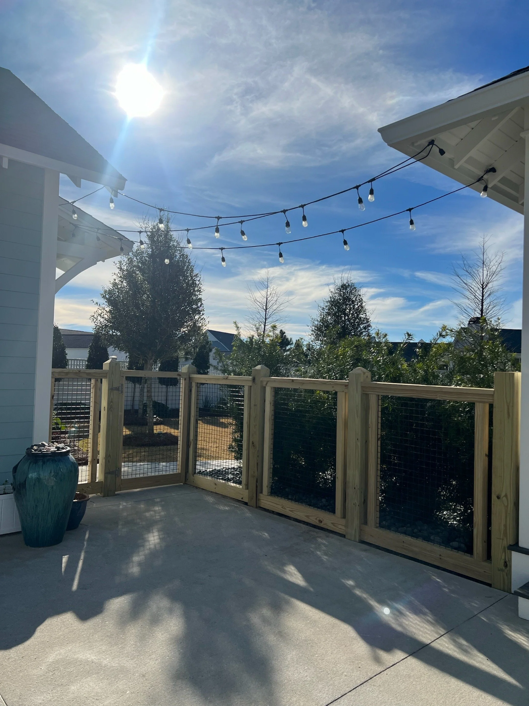 Patio and landscape lighting glowing at dusk